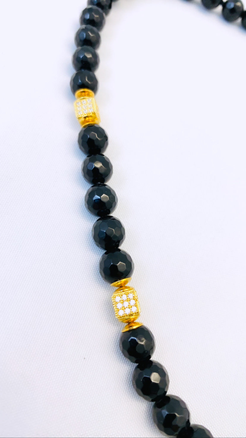 Collier “giostrina” in onice e argento 925 placcato oro giallo