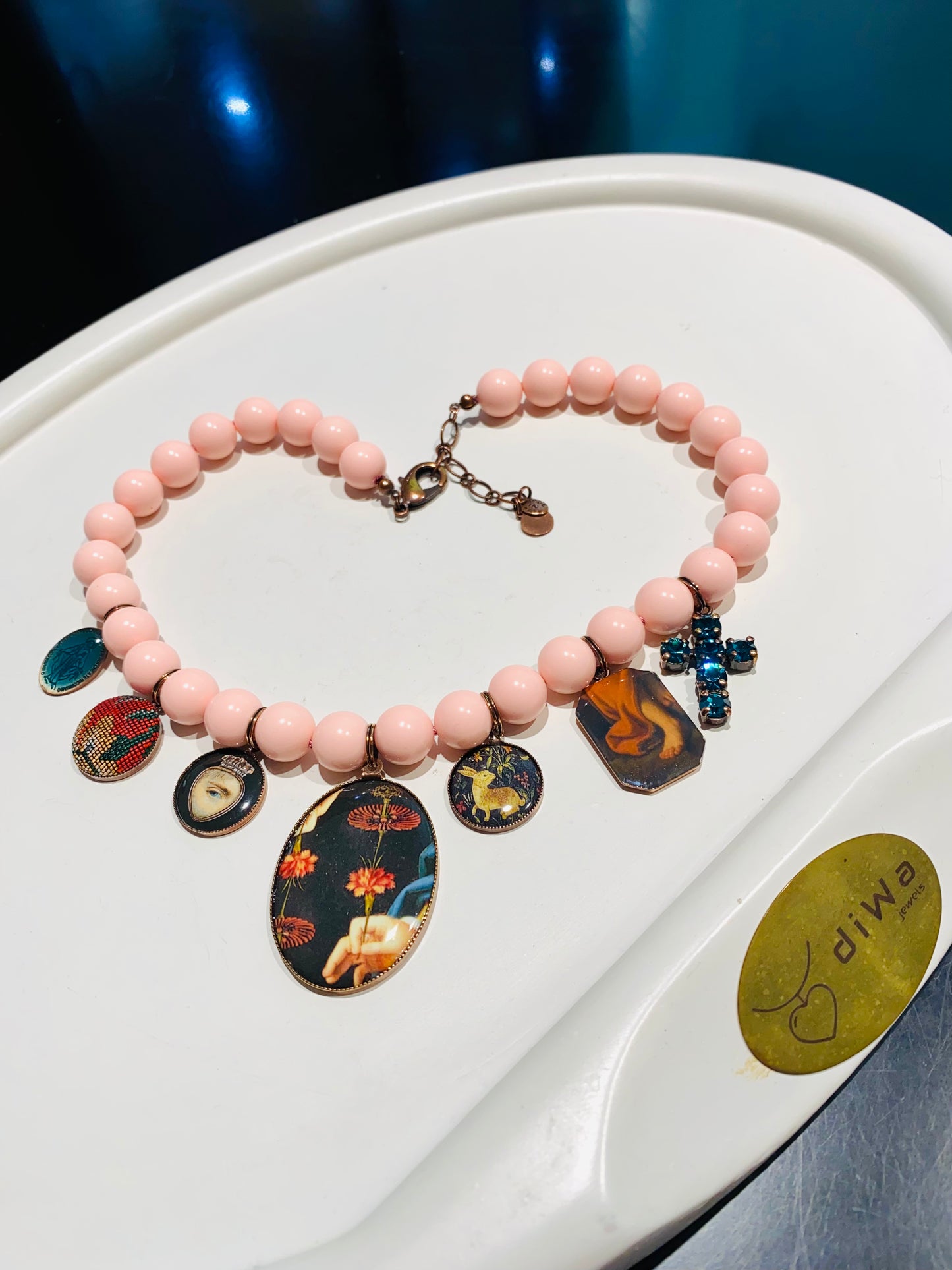 Collana con charms vintage e conchiglia rosa in argento sterling