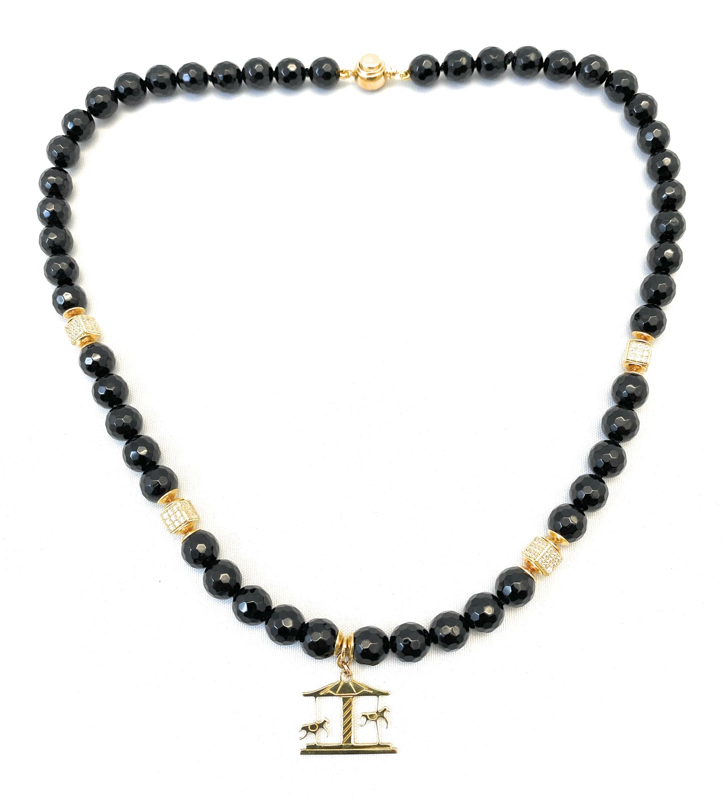 Collier “giostrina” in onice e argento 925 placcato oro giallo