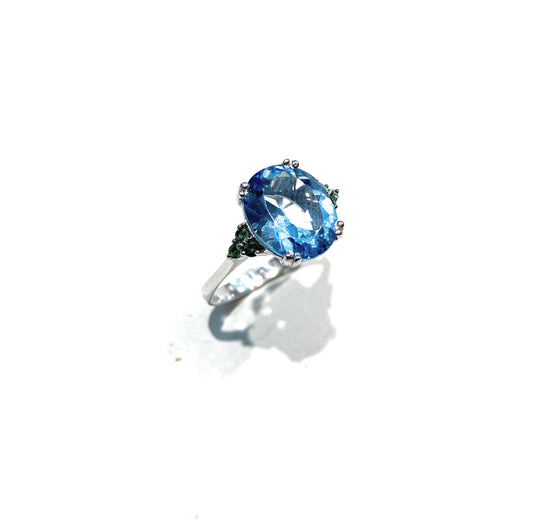 Anello oro 18 kt topazio azzurro e smeraldi